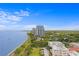 Scenic aerial view of the coastline with blue water and high rise luxury condos near the water at 3301 Bayshore Blvd # 2108B, Tampa, FL 33629