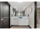 Dual sinks and a large mirror create a clean and functional bathroom at 3301 Bayshore Blvd # 2108B, Tampa, FL 33629