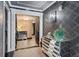 Elegant entryway featuring stylish black double doors, a mirrored dresser and patterned wallpaper at 3301 Bayshore Blvd # 2108B, Tampa, FL 33629