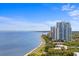Scenic waterfront view of a condominium complex with manicured grounds and stunning bay access at 3301 Bayshore Blvd # 2108B, Tampa, FL 33629