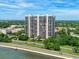 Striking exterior view of a high-rise building with manicured landscaping and waterfront access at 3301 Bayshore Blvd # 2108B, Tampa, FL 33629