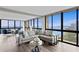 Bright living room featuring floor-to-ceiling windows offering a stunning panoramic water view at 3301 Bayshore Blvd # 2108B, Tampa, FL 33629