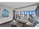 Comfortable living room with a stylish sofa, modern art, and expansive windows with water views at 3301 Bayshore Blvd # 2108B, Tampa, FL 33629