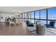 Open concept living space with modern kitchen, dining, and seating areas, plus floor-to-ceiling water views at 3301 Bayshore Blvd # 2108B, Tampa, FL 33629