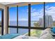 Bedroom with a large window offering cityscape and water views at 3301 Bayshore Blvd # 2108B, Tampa, FL 33629