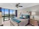 Comfortable bedroom features a tufted headboard, mirrored nightstands, and a beautiful city view at 3301 Bayshore Blvd # 2108B, Tampa, FL 33629