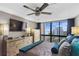 Relaxing main bedroom has a ceiling fan, mounted TV, and cityscape views at 3301 Bayshore Blvd # 2108B, Tampa, FL 33629