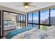 Inviting bedroom showcasing water views, mirrored closet doors and ceiling fan at 3301 Bayshore Blvd # 2108B, Tampa, FL 33629