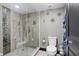 Modern shower with tile surround, a handheld sprayer, and neutral tile flooring at 3301 Bayshore Blvd # 2108B, Tampa, FL 33629