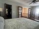 Comfortable bedroom with closet and staircase access at 3316 S Shamrock Rd, Tampa, FL 33629