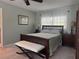 Cozy bedroom featuring a comfortable bed, soft lighting, and natural decor at 3316 S Shamrock Rd, Tampa, FL 33629