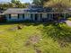 Inviting home showcasing a well-maintained lawn and appealing curb appeal at 3316 S Shamrock Rd, Tampa, FL 33629