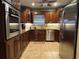 Modern kitchen featuring stainless steel appliances and granite countertops at 3316 S Shamrock Rd, Tampa, FL 33629