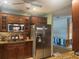 Well-equipped kitchen boasting a stainless steel refrigerator and stylish cabinetry at 3316 S Shamrock Rd, Tampa, FL 33629