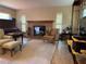 Comfortable living room featuring a cozy fireplace and ample natural light at 3316 S Shamrock Rd, Tampa, FL 33629