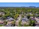 Panoramic aerial showcases a neighborhood with tree-lined streets and skyline in the distance at 3504 N 12Th St, Tampa, FL 33605