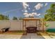 Backyard featuring a gazebo with outdoor seating and a well-maintained fence at 3504 N 12Th St, Tampa, FL 33605