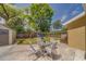 This backyard features mature trees, outdoor furniture, a playset and a shed at 3504 N 12Th St, Tampa, FL 33605