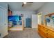 Cozy bedroom features a custom bunk bed with space-themed decor and soft, neutral carpeting at 3504 N 12Th St, Tampa, FL 33605