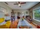 This dining area features hardwood floors, natural light, and views into the living room at 3504 N 12Th St, Tampa, FL 33605