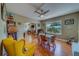 This dining area features hardwood floors, natural light, and views into the living room at 3504 N 12Th St, Tampa, FL 33605