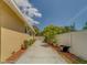 This house features a long driveway with plenty of room for parking and mature landscaping at 3504 N 12Th St, Tampa, FL 33605
