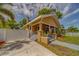 Charming home featuring a well-maintained lawn and a welcoming front porch with classic design elements at 3504 N 12Th St, Tampa, FL 33605