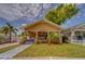 Charming home with a welcoming porch and neatly landscaped yard, creating curb appeal at 3504 N 12Th St, Tampa, FL 33605