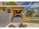 Inviting front porch with steps, brick accents, and decorative hanging planters at 3504 N 12Th St, Tampa, FL 33605