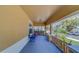 Spacious front porch with seating area and classic architectural details, perfect for outdoor enjoyment at 3504 N 12Th St, Tampa, FL 33605