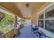 Inviting front porch offers a relaxed seating area with classic brick and stucco pillars at 3504 N 12Th St, Tampa, FL 33605