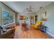 Bright living room showing open floor plan with hardwood floors, dining area, and comfortable seating arrangements at 3504 N 12Th St, Tampa, FL 33605