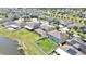 Community aerial highlighting the community, lush landscaping, and serene pond views at 35965 Saddle Palm Way, Zephyrhills, FL 33541