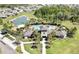 Beautiful aerial view of a community pool, clubhouse, and scenic surroundings at 35965 Saddle Palm Way, Zephyrhills, FL 33541