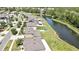 Aerial view of neighborhood homes with pond and green space, showcasing the community's layout and landscaping at 35965 Saddle Palm Way, Zephyrhills, FL 33541