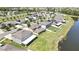 Aerial view featuring the community, backyard pond views, and residential surroundings at 35965 Saddle Palm Way, Zephyrhills, FL 33541