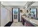 Bathroom with dual sinks, granite countertops, and stylish decor at 35965 Saddle Palm Way, Zephyrhills, FL 33541