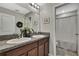 Elegant bathroom with double vanity and granite countertops, featuring modern fixtures at 35965 Saddle Palm Way, Zephyrhills, FL 33541