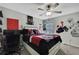 Cozy bedroom with a ceiling fan, gray walls, and playful decor offers a personal and comfortable space at 35965 Saddle Palm Way, Zephyrhills, FL 33541