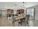An inviting dining room adjacent to the kitchen, bathed in natural light creating a warm and welcoming atmosphere at 35965 Saddle Palm Way, Zephyrhills, FL 33541