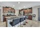 Kitchen with a large granite island and barstool seating offering a welcoming and social cooking experience at 35965 Saddle Palm Way, Zephyrhills, FL 33541