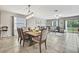 Open-concept living room and dining area offering seamless transition and an abundance of natural light at 35965 Saddle Palm Way, Zephyrhills, FL 33541