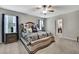 Comfortable main bedroom with a ceiling fan and an ensuite bathroom at 35965 Saddle Palm Way, Zephyrhills, FL 33541