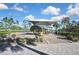 Playground features a sunshade covering swings and slides and is surrounded by brick pavers at 35965 Saddle Palm Way, Zephyrhills, FL 33541