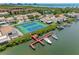 Aerial view of community tennis courts, boat docks and waterfront access offering a vibrant lifestyle at 4319 Harbor House Dr, Tampa, FL 33615