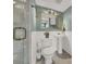 Bathroom with tile floor, shower, toilet, and a pedestal sink at 4319 Harbor House Dr, Tampa, FL 33615