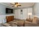 Spacious bedroom with a ceiling fan, an armchair, a dresser, and multiple closets at 4319 Harbor House Dr, Tampa, FL 33615