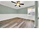 Bedroom with hardwood flooring, ceiling fan, and a window with natural light at 4319 Harbor House Dr, Tampa, FL 33615