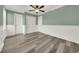 Bedroom features hardwood floors, crown molding, ceiling fan, and plenty of closet space at 4319 Harbor House Dr, Tampa, FL 33615