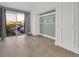 Bedroom with tile floor, a sliding glass door, and built-in cabinets at 4319 Harbor House Dr, Tampa, FL 33615